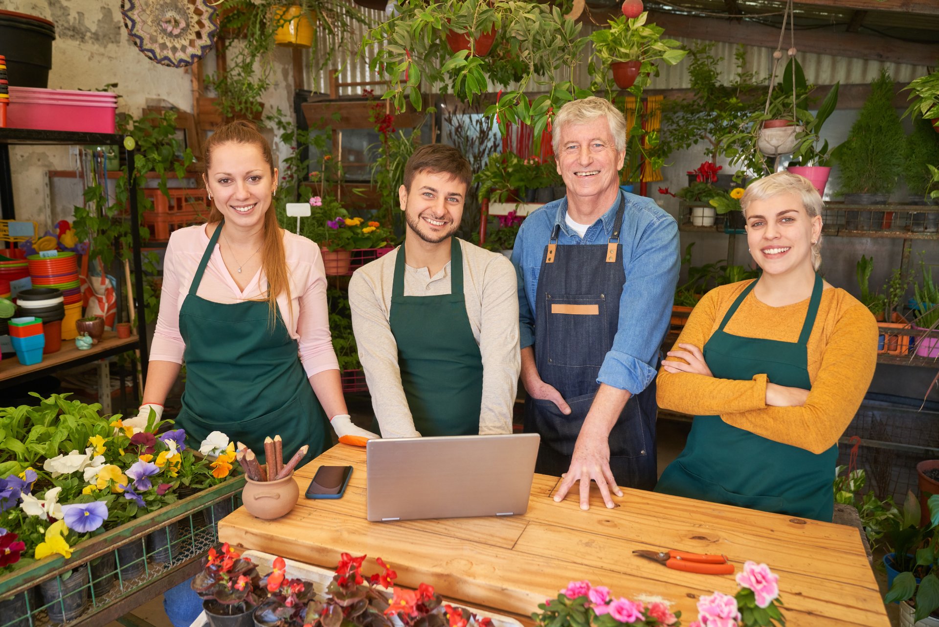 Smiling,Florist,Team,In,The,Flower,Shop,At,The,Laptop