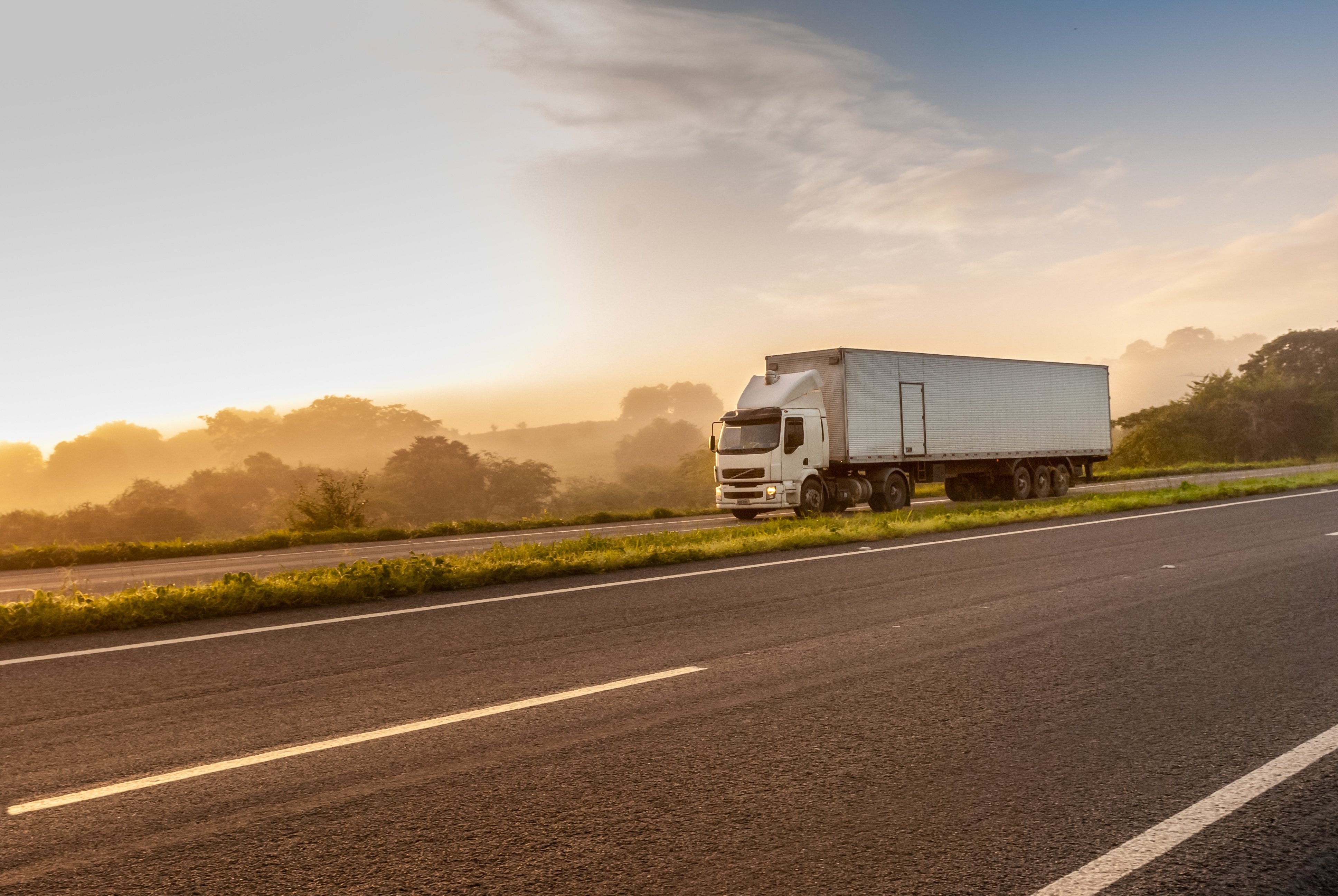 Refrigerated truck using refrigerated transport solutions to safely manage interstate refrigerated freight and frozen transport on long hauls.